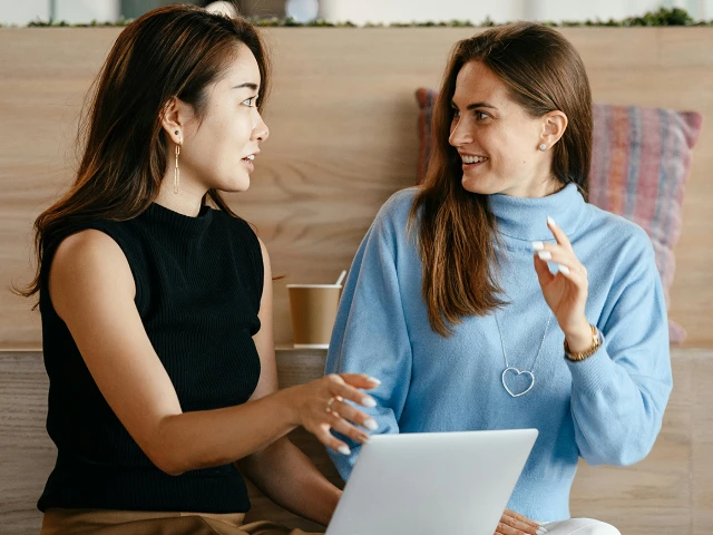 Japanese woman and international teacher having a relaxed, practical English conversation.
