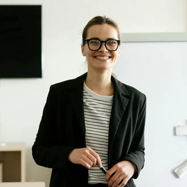 Sara Thompson, a warm and professional English instructor at our school.